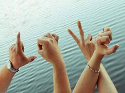 couples hands spelling love